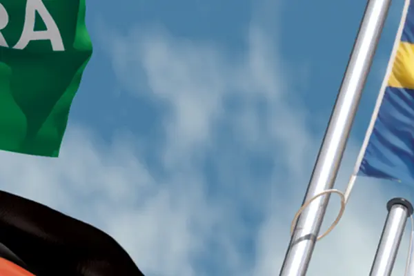 Several flags from different countries with sky as background. Several flags from different countries with sky as background.